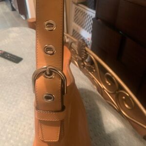 Tan, leather Coach bag. No tears or rips. Great shape.